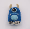 A small felted wool monster figurine in bright blue, and light blue merino felt. Handmade/Needle Felt. 