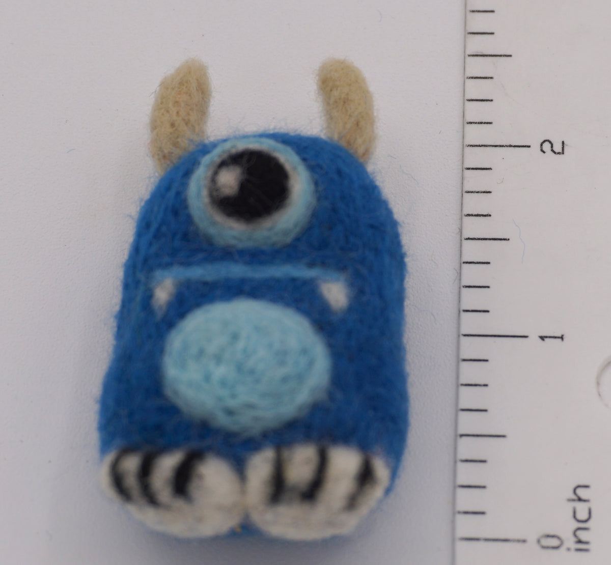Image showing the length of toy next to measuring ruler. 