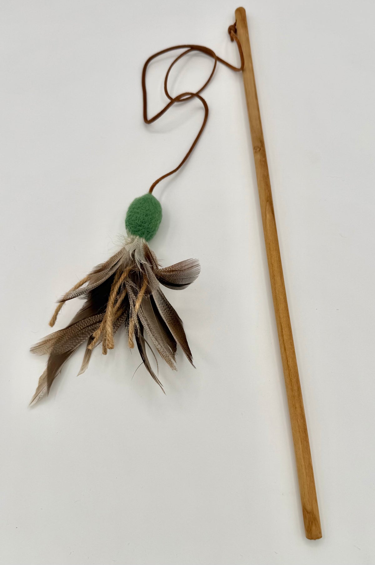 Cats will love the textures of the felt, fearthers and twine teaser. 