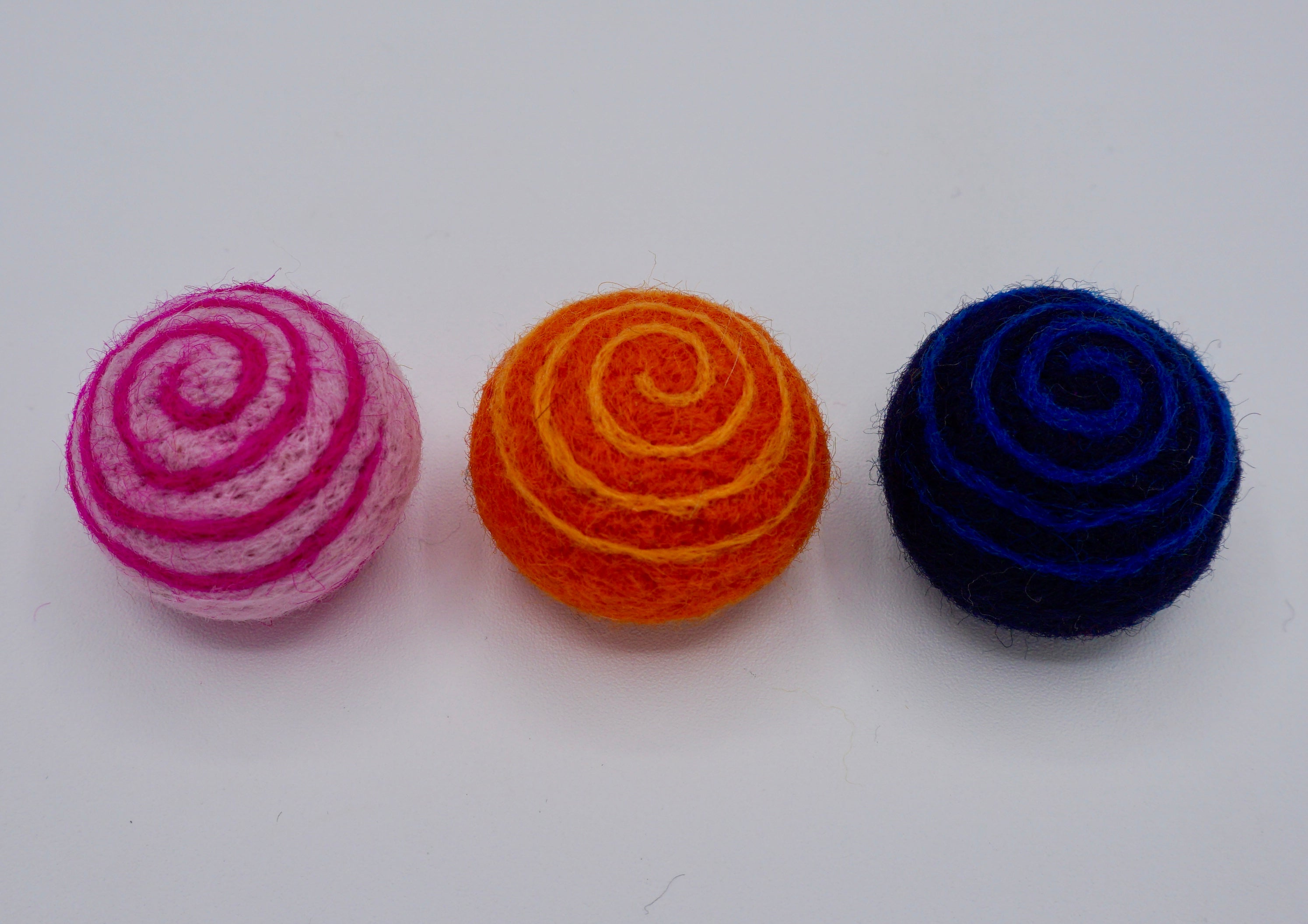 The trio of needle felt swirly cat toys for your favorite feliine. 