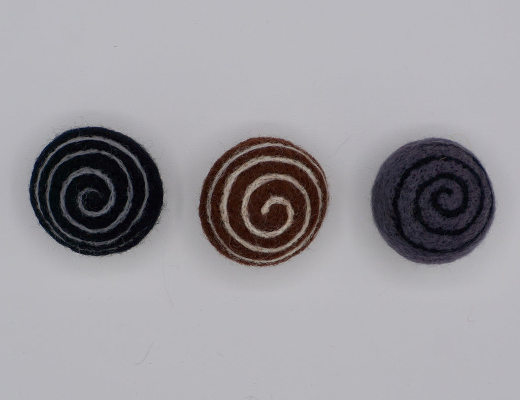 Comes in a set of three Swirly felts; black, brown & gray. 